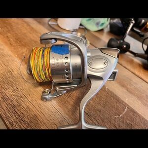 Shimano Stella 6000F Silver Reel with extra spool and branded line.